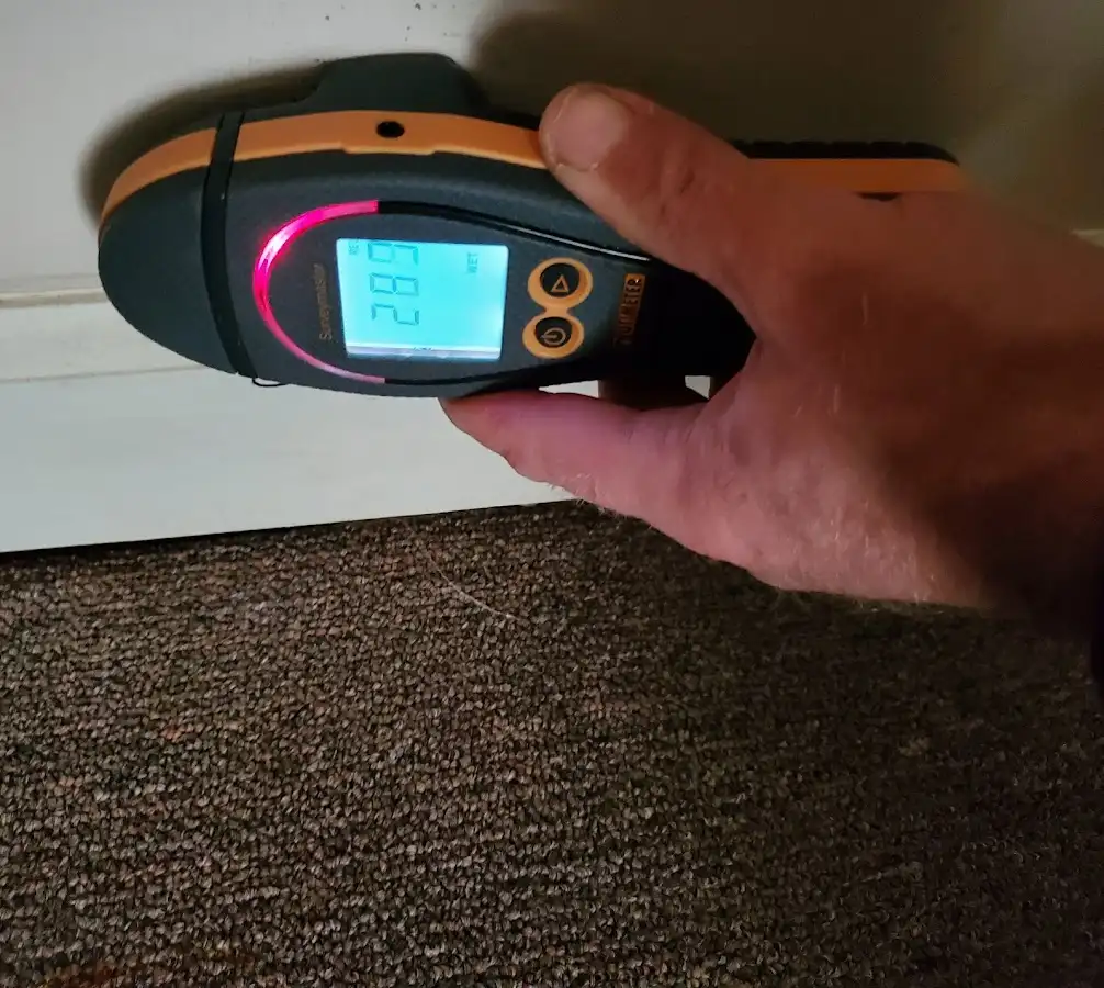 Moisture detection at baseboard during Storm Damage Restoration in Dayton